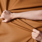 Fauteuil pivotant glamour en tissu résistant aux rayures