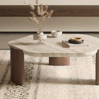 Table basse moderne hexagonale/ronde avec plateau en travertin beige.