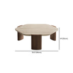 Table basse moderne hexagonale/ronde avec plateau en travertin beige.